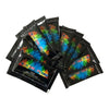Packets of color changing fire for outdoor flames in black and green packaging