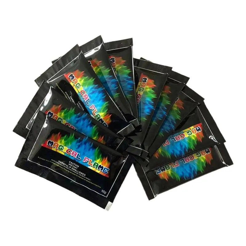 Packets of color changing fire for outdoor flames in black and green packaging