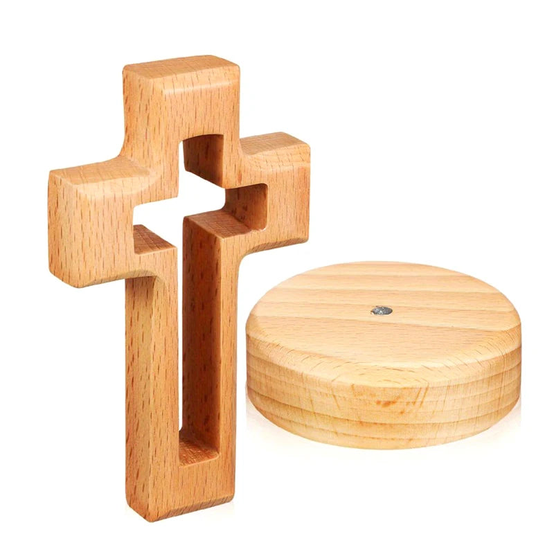 Handcrafted wooden cross standing ornament made of light-colored wood.