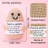 A handmade crochet potato doll with a positive encouragement card knitted fabric and inspirational words