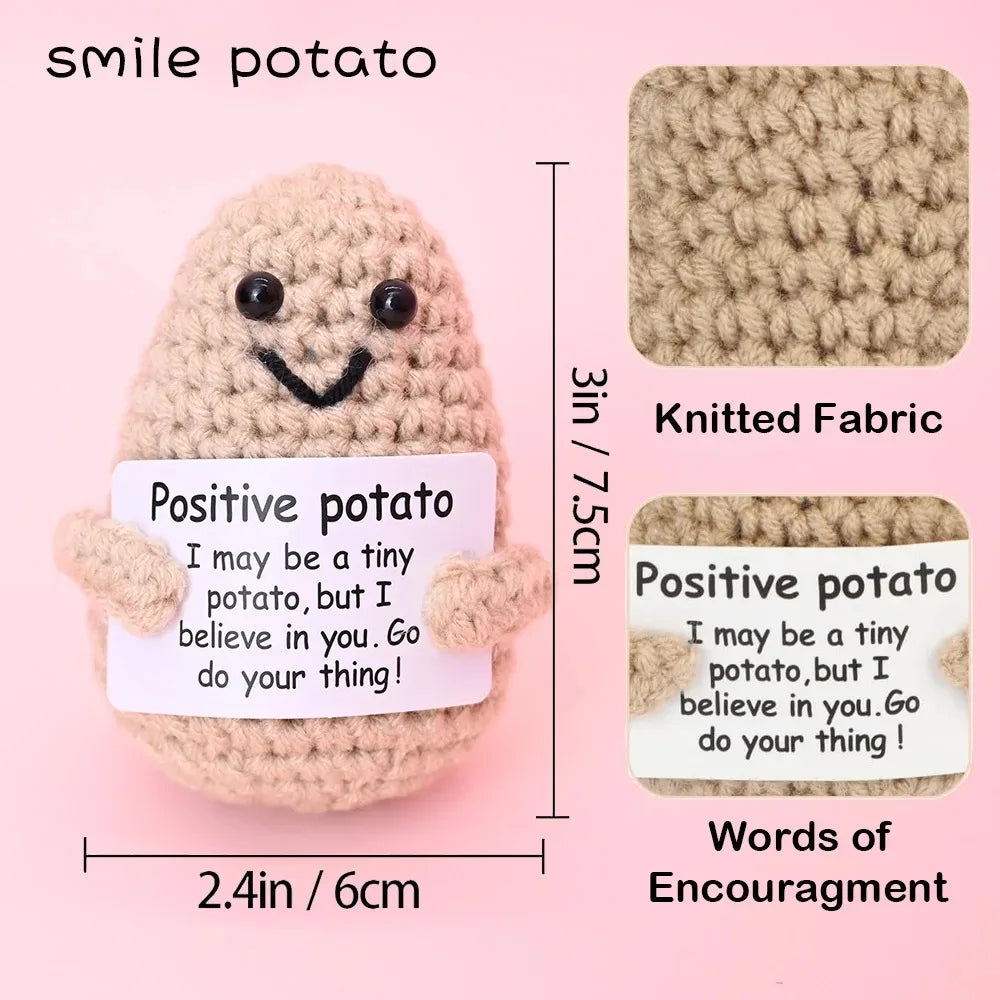 A handmade crochet potato doll with a positive encouragement card knitted fabric and inspirational words