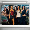 A group of six women posing in a dark, glamorous style against a backdrop with text that reads Happy Birthday.