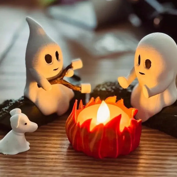 A set of white ghost figures surrounding a glowing orange campfire on a wooden surface.