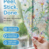 Hand applying peel stick done window film featuring vintage floral mosaic design for privacy and UV protection