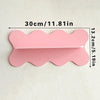 A pink cherry-shaped wooden wall shelf measuring 30cm or 11.81in.