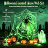 Green glow spider web decor with pumpkins and a ghost set for Halloween