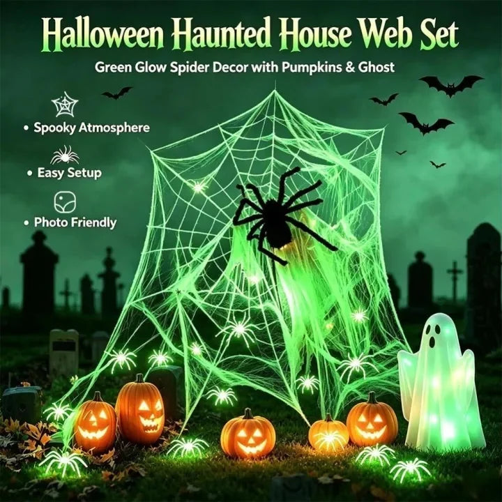Green glow spider web decor with pumpkins and a ghost set for Halloween