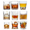 A collection of various whiskey glasses, including tumblers and rocks glasses, showcasing different styles and sizes.