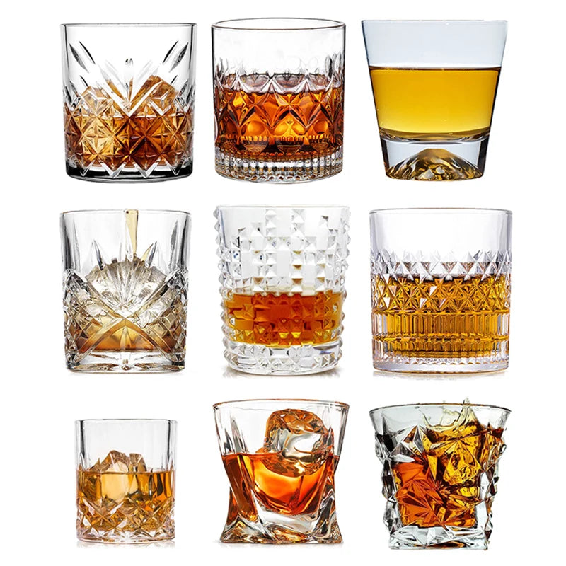 A collection of various whiskey glasses, including tumblers and rocks glasses, showcasing different styles and sizes.