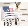 A white wall-mounted organizer featuring a mail slot, storage platform, drawer, and six hooks for keys.