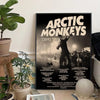 A black and white poster featuring the Arctic Monkeys band with tour dates for various shows.