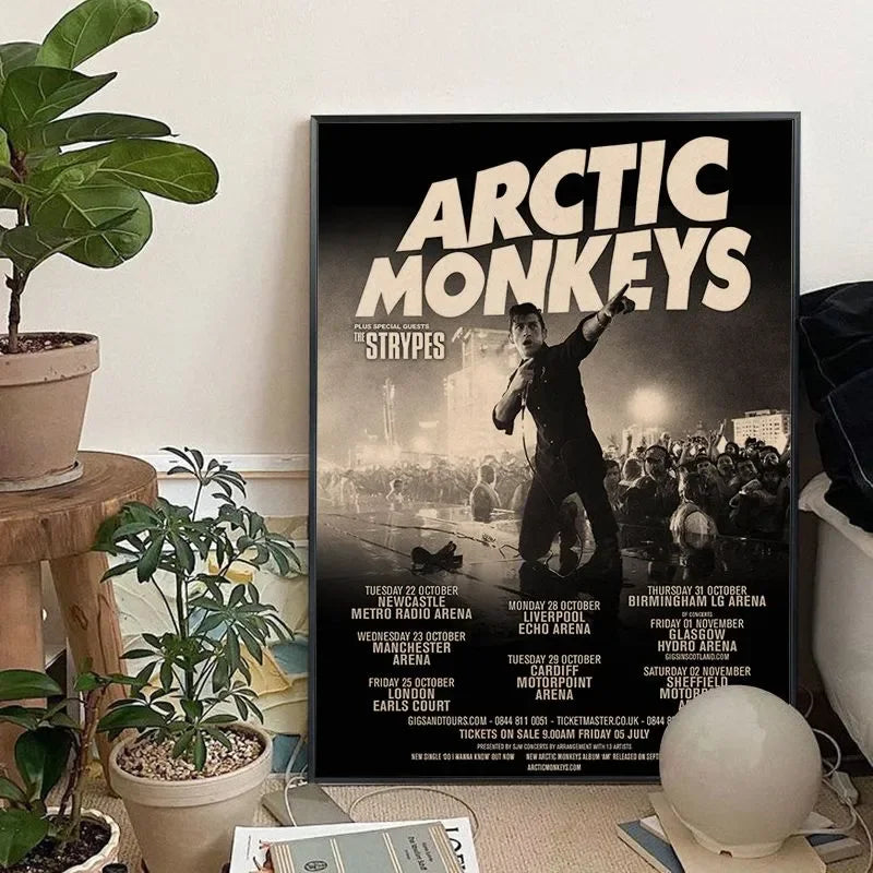 A black and white poster featuring the Arctic Monkeys band with tour dates for various shows.