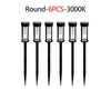 Six round solar pathway lights with black fixtures and illuminated bulbs.