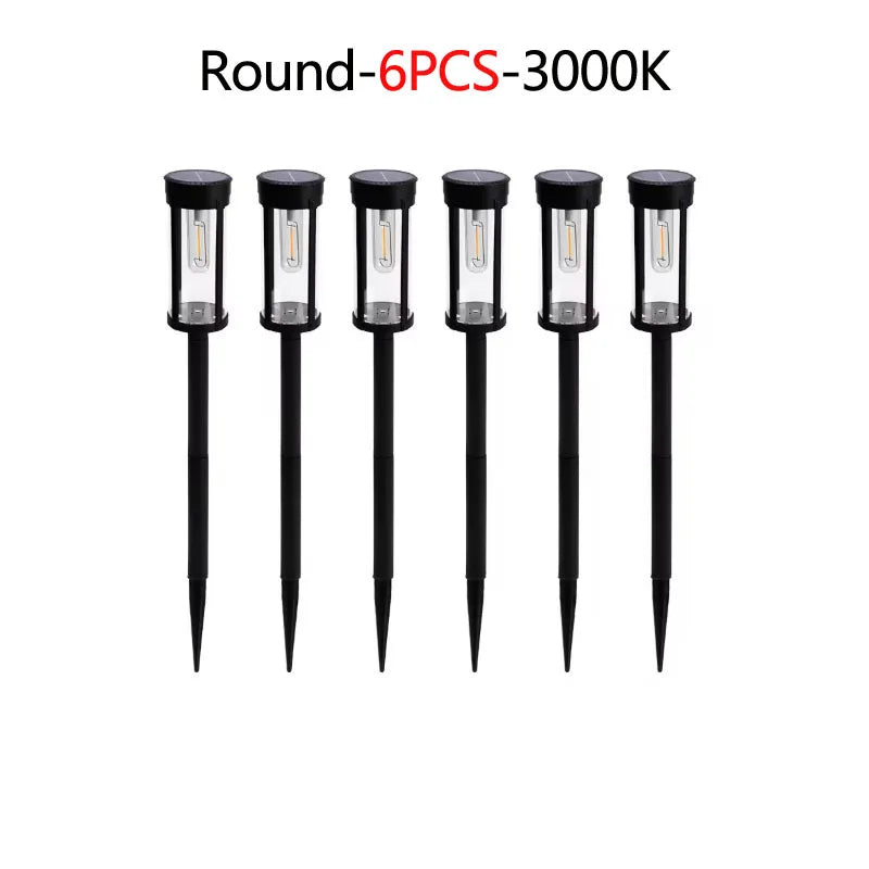 Six round solar pathway lights with black fixtures and illuminated bulbs.