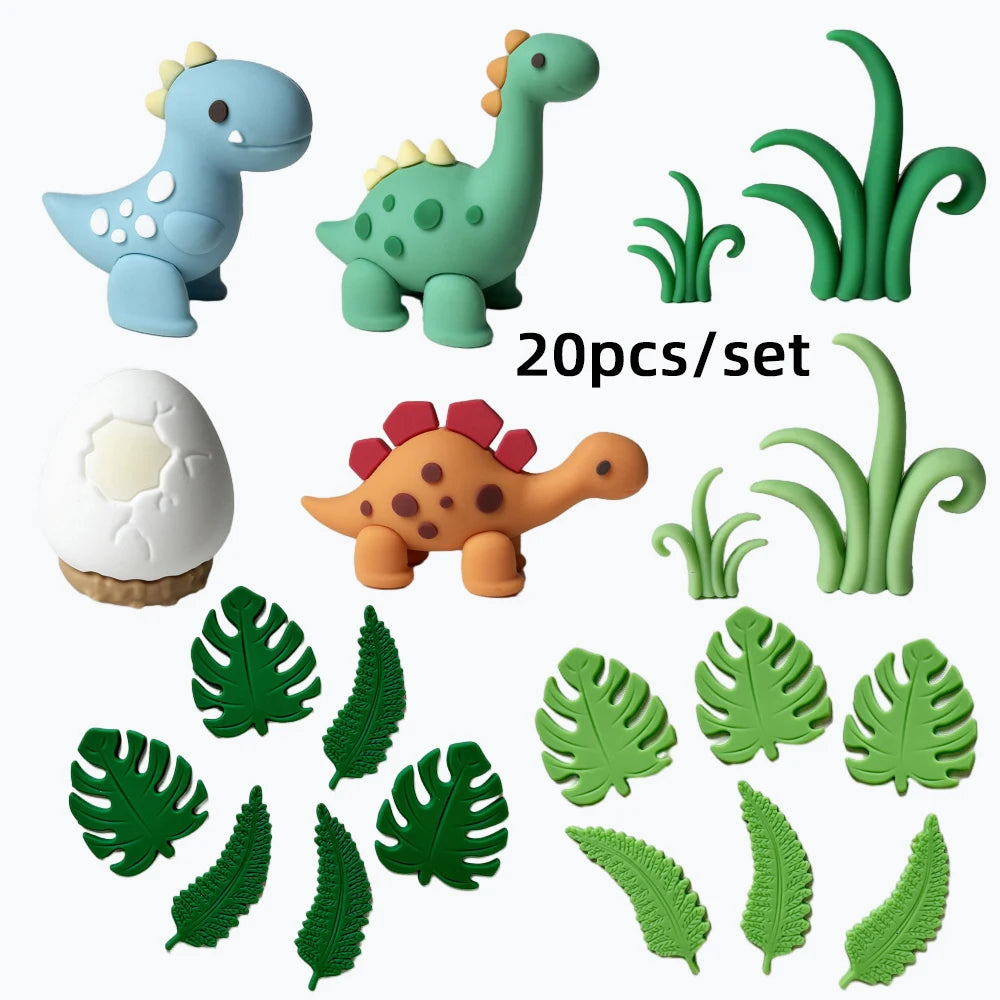 Un juego de 20 toppers de pastel de dinosaurios verdes y azules.