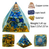 A pyramid-shaped crystal display featuring copper wire, lapis lazuli stones, and gold foil.