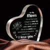 A clear heart-shaped acrylic keepsake engraved with the message I love you to my mom