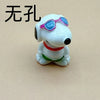 A white ceramic dog pendant with pink-framed sunglasses and a red collar.