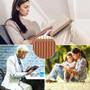 A woman reads a Bible with leather bookmarks, and another woman reads a book outdoors.