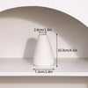 A white ceramic vase is displayed on a shelf, showing its dimensions.