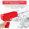 A hand holds a red money shooter toy spraying banknotes onto a surface.