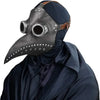 A black plague doctor mask with a long beak and leather straps, worn by a person in a dark blue cloak.
