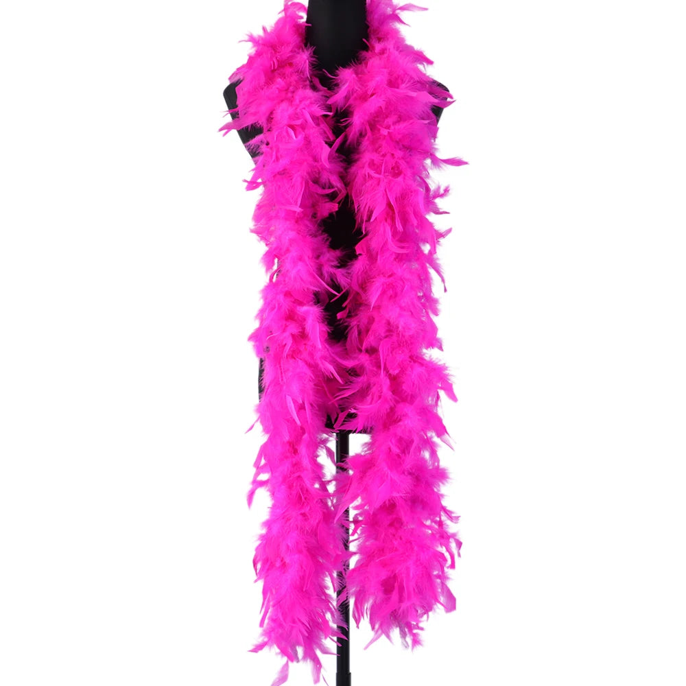 A vibrant pink natural turkey feather boa displayed on a black hanger.