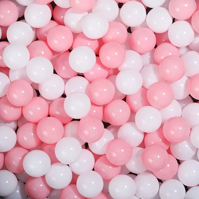 A close-up view of a 50-pack of colorful pink and white star-shaped balls for kids' play areas.