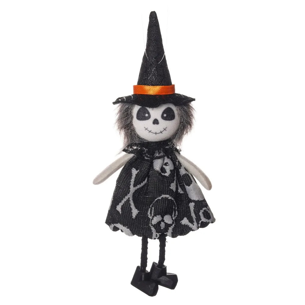A black witch ornament featuring a pointed hat, orange trim, and a face painted like a skull.