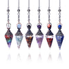 A set of five natural crystal teardrop pendants hanging from chains, featuring various colors like blue, purple, and red.