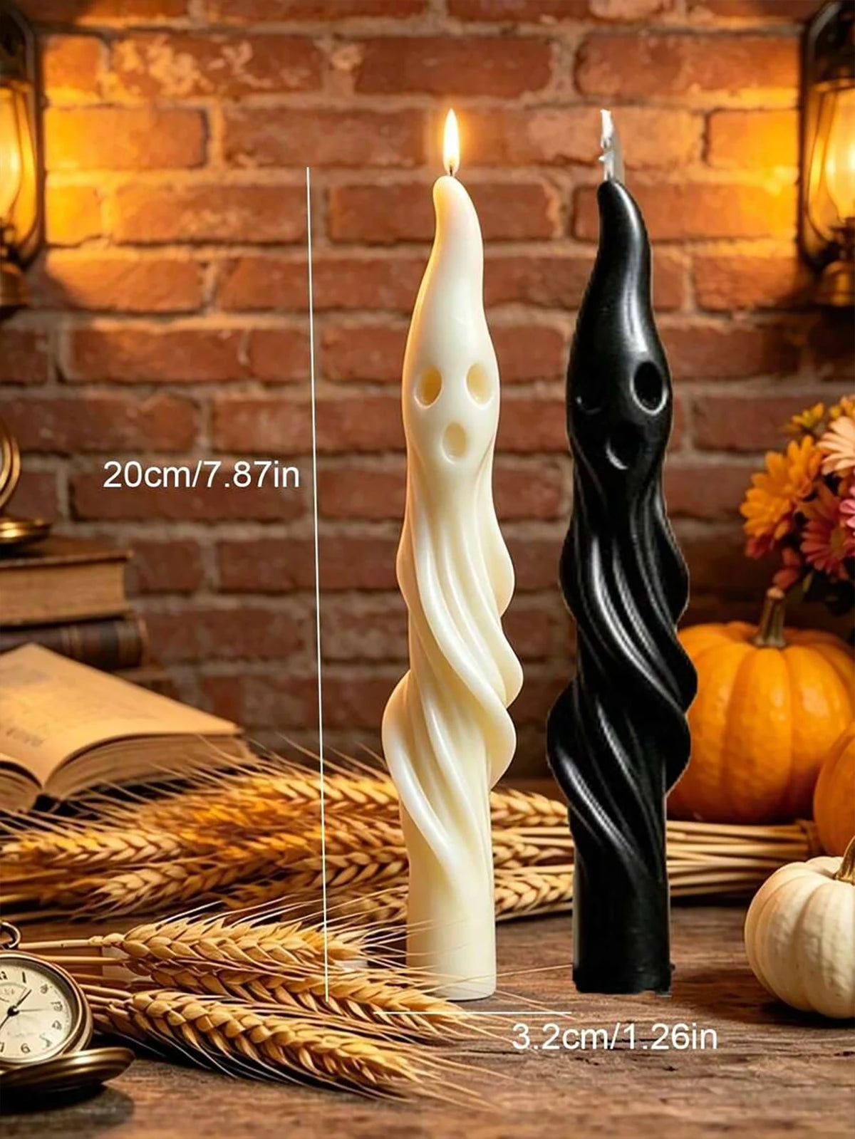 A set of black and white ghost and mummy scented soy candles displayed on a wooden surface with wheat stalks.