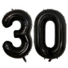 A set of two giant black foil balloons shaped like the number 30