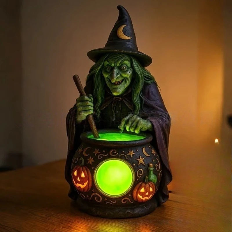 A green-skinned witch figure with long hair holds a staff above a glowing green lantern decorated with pumpkins.