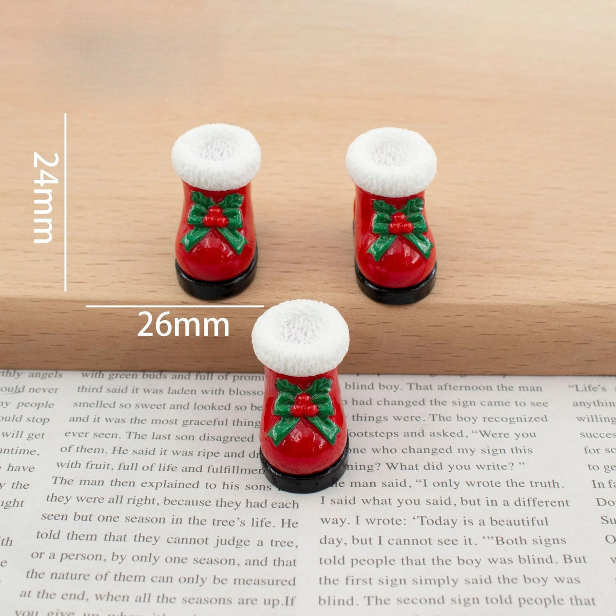 A set of festive Christmas resin decor featuring red and green ornaments with white fluffy tops.