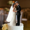 Elegant bride and groom cake topper featuring a couple in wedding attire