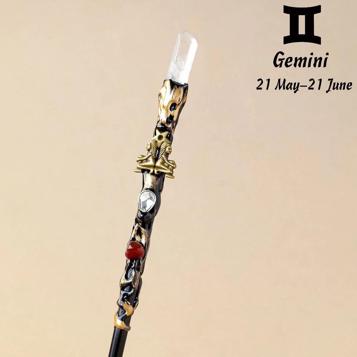 A natural clear quartz zodiac crystal wand with gold accents and a clear crystal tip.