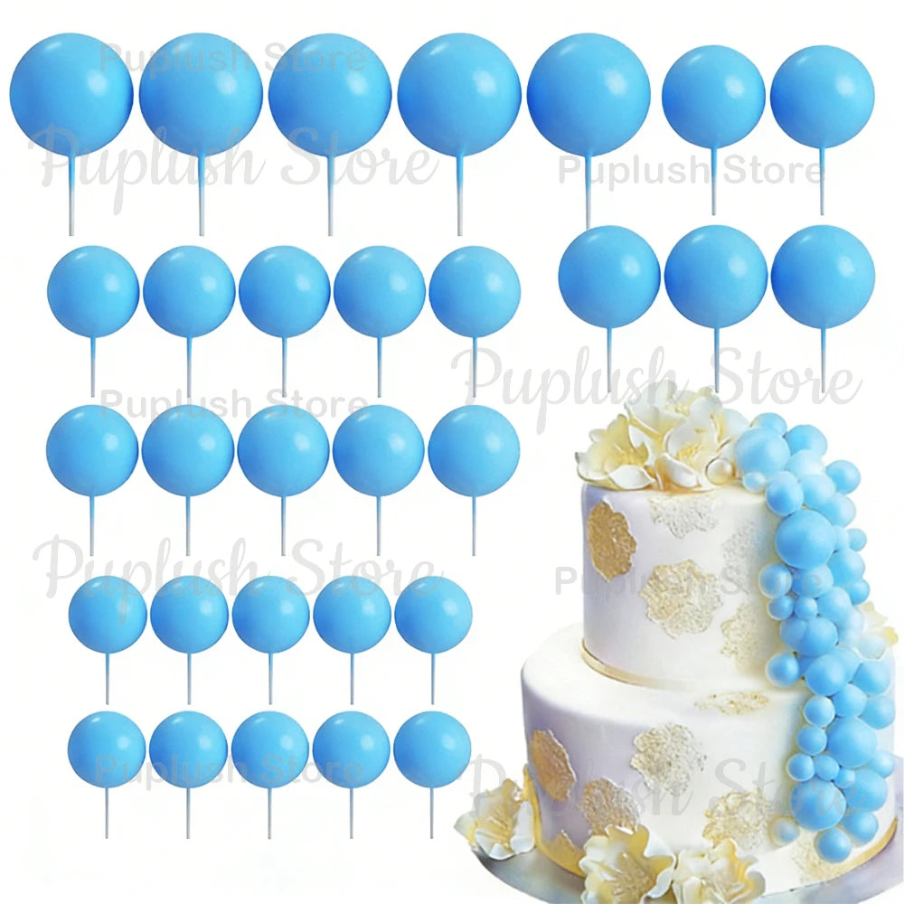 A set of light blue foam cake toppers on sticks, arranged in various sizes and colors.