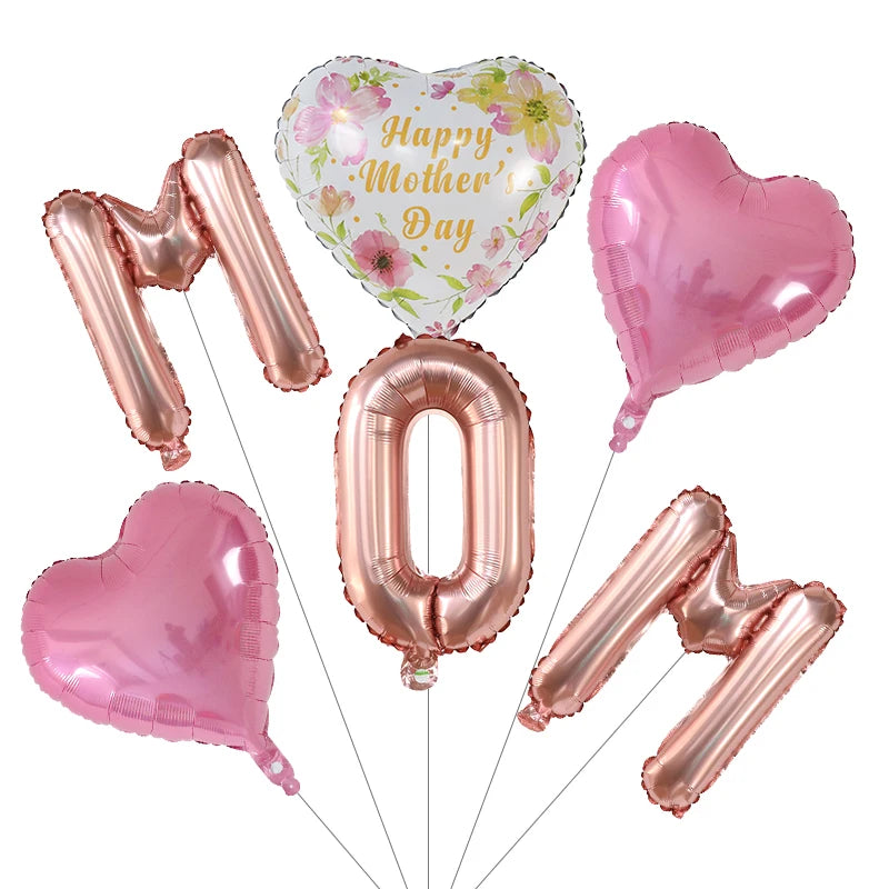 A set of six pink and gold foil balloons, including a heart-shaped balloon with Happy Mother's Day text and several other hea