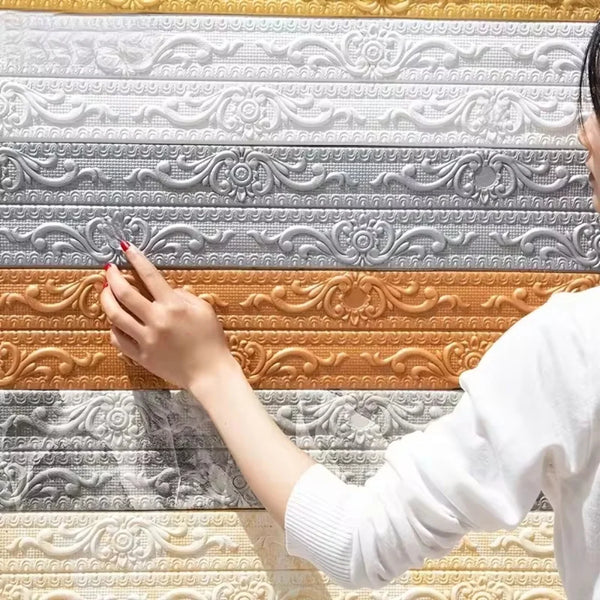 A hand is touching a decorative self-adhesive PVC corner trim featuring various textured and embossed patterns in silver, ora