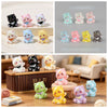 A collection of colorful kawaii 3D resin animal keychains in various pastel and vibrant colors displayed on a wooden surface.