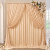 A floor-to-ceiling beige draped fabric backdrop for an event or photo shoot
