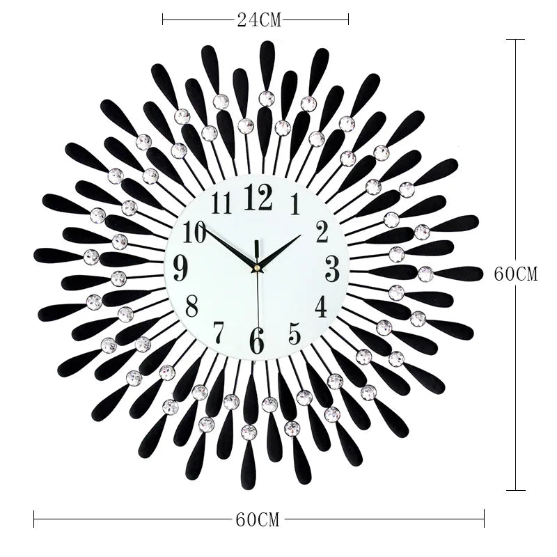 A modern minimalist metal wall clock with a black and silver sunburst design and Roman numerals.