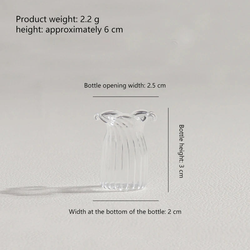 A clear glass flower bouquet bottle with a narrow opening and a rounded shape.