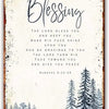 Wall art sign featuring elegant script text of a blessing and a forest silhouette.