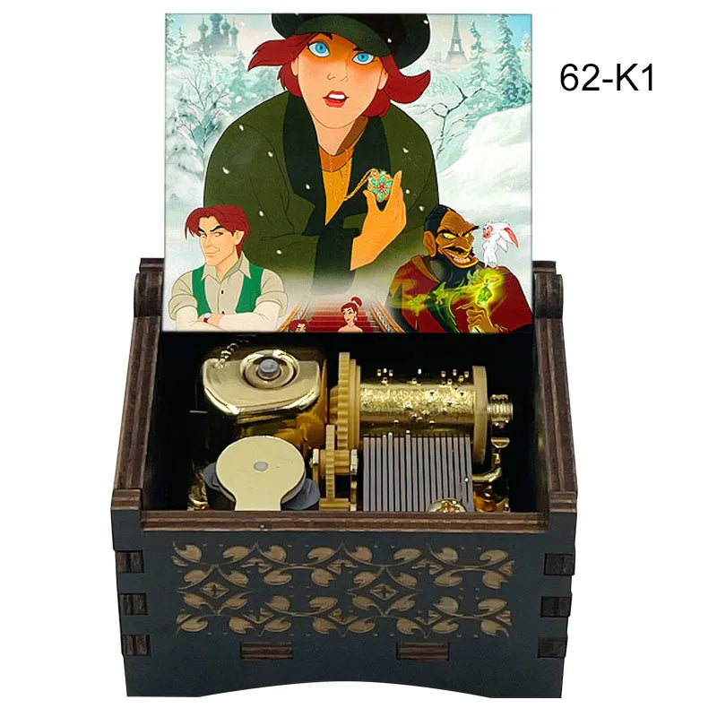 A hand-cranked wooden music box featuring characters from Once Upon a December on the lid and an open mechanism below.