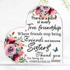 Placa de acrílico transparente con diseño floral y texto sobre verdadera amistad y hermandad