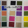 A collection of fabric swatches in various shades of milk coffee, including browns, blues, greens, and pinks.