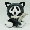 A plush toy resembling a cat face with black and white markings and a hood.