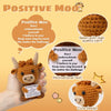 A crocheted Highland cow keychain with a motivational text tag and sewing instructions.