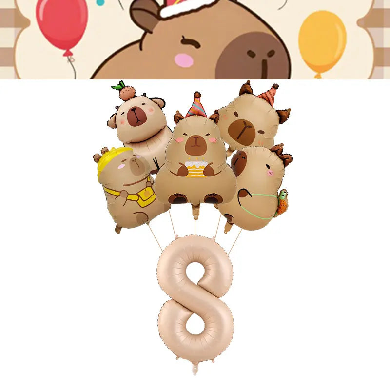 A set of cute capybara-themed birthday decorations including plush toys and a large number balloon